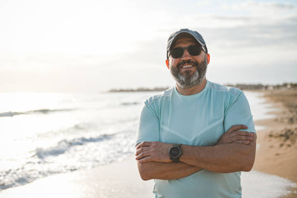 istock Man walking and doing sports on the beach 2061057655