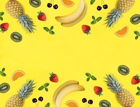 Fruit and berry on the yellow background. Copy space. Top view. Flat lay.