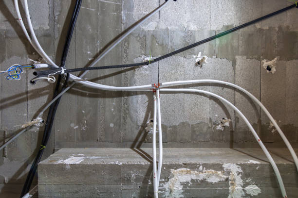 istock Unfinished ceiling with visible electrical and plumbing installations in a construction site of a new house 2061102941