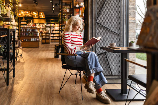 istock Young Woman Immersed in a Cafe Novel 2061103754