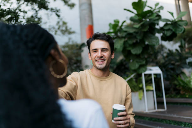 istock Friends standing out a coffee shop and talking 2061103909