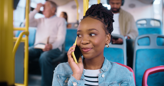 Black woman, bus and smile with phone call for conversation, reading and thinking by window in public for travel. African girl, transport and happy with smartphone, mobile network and chat in city