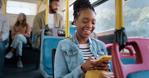 istock Woman, cellphone and bus commute with texting online on public transportation, connection or location. Black person, smartphone and city metro vehicle in America for traveling, chat or social media 2061104773