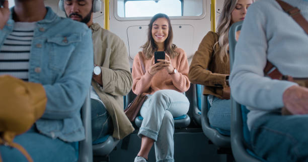 istock Woman, bus and phone for texting with smile, reading and comic meme for post on web in public for travel. Girl, transportation and happy with smartphone, social network and mobile application in city 2061104807