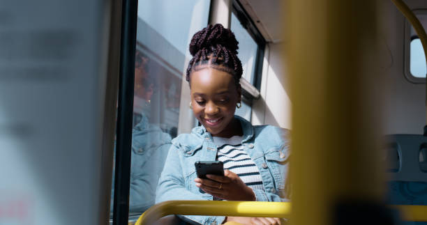 istock African woman, bus and smartphone for travel with texting, reading or thinking for post on web blog on public transit. Girl, transportation and notification for social network with mobile app in city 2061104812