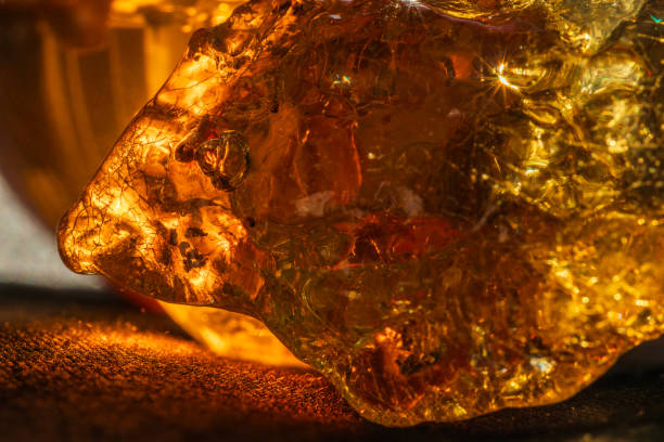 istock Amber crystal close up in orange light 2061127684