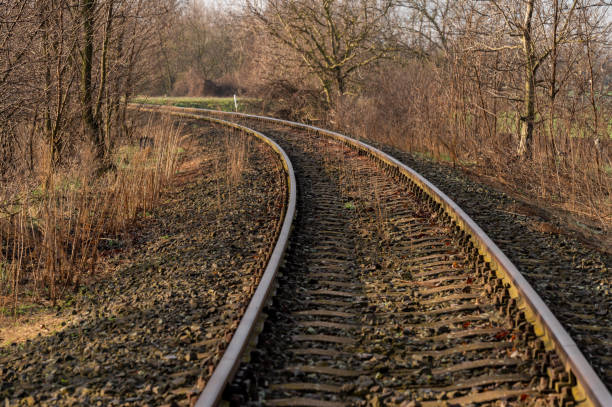 Curved railroad track in the countryside