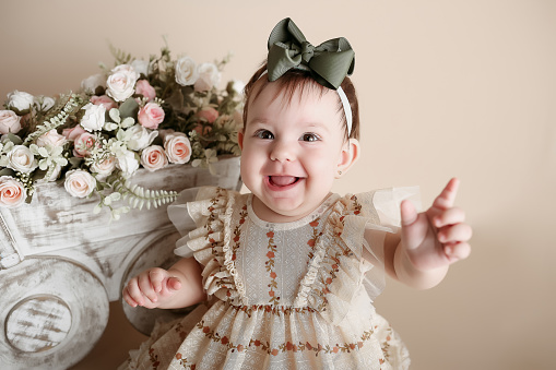 baby girl posing and smiling