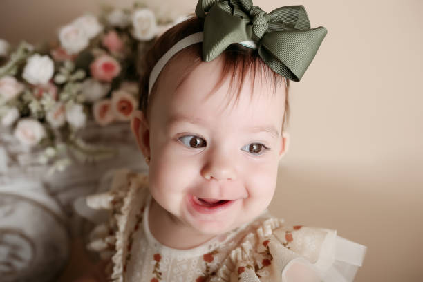 baby girl posing and smiling