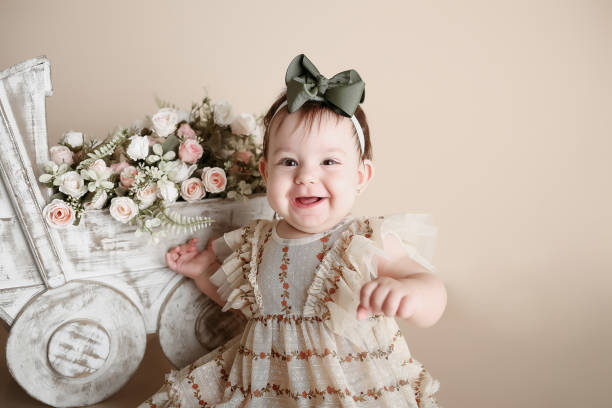 istock baby girl posing and smiling 2061137594