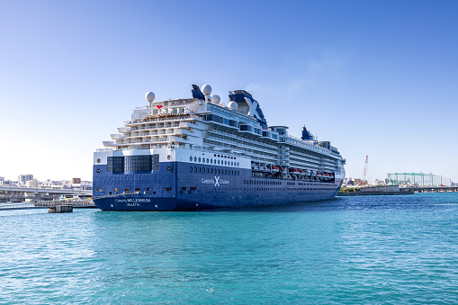 naha, okinawa, japan - october 30 2023: huge cruise ship moored in the harbor of naha city in okinawa, japan.