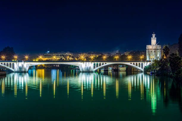 istock San Telmo Bridge and Torre Del Oro at Night, Seville 2061190202