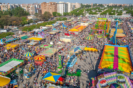 Crowds enjoy rides and attractions at the vibrant Sevilla April Fair.