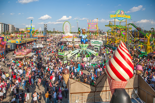 Crowds enjoy rides and attractions at the vibrant Sevilla April Fair.