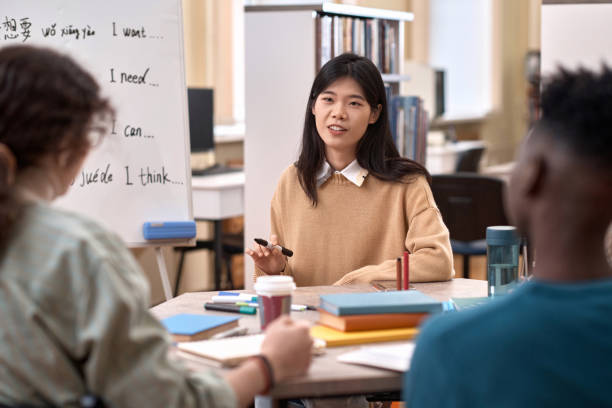 istock Female Teacher Talking To Group of Students 2061200124