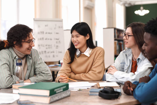 istock Diverse Group of Young People Studying at Table 2061200141