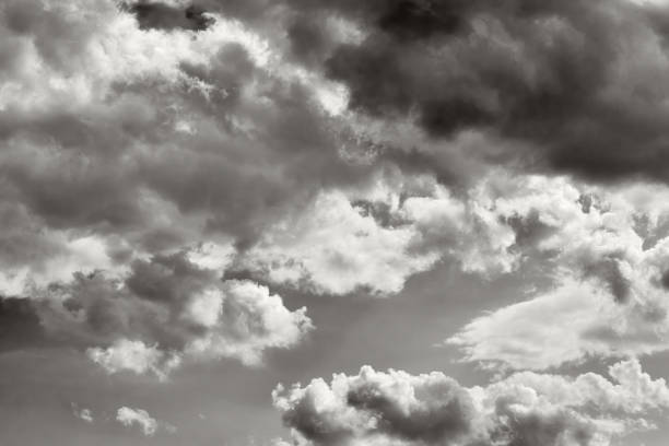istock Gray sky with white clouds. Monochrome sky. Black and white photo 2061216672