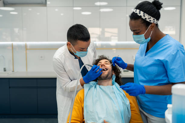 istock Dentists using a dental drill during a dental intervention at medical clinic 2061224877