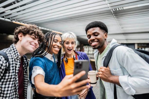 istock Friends taking a selfie using mobile phone at university 2061251100