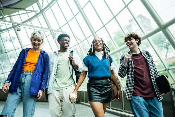 istock Friends walking and talking at subway station 2061254529