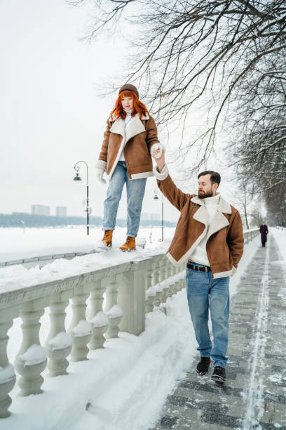 istock Romantic couple in winter park 2061271975