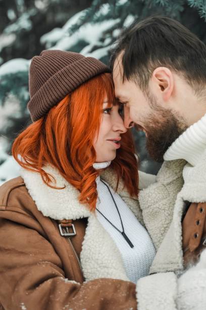 istock Romantic couple in winter park 2061271988