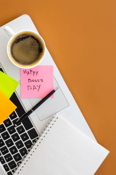 istock Boss day concept, laptop and cup of coffee on table, flat lay. 2061274656
