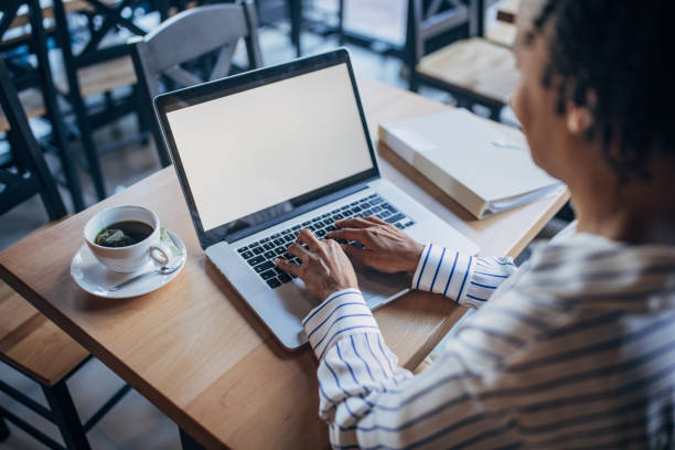 istock Businesswoman using laptop in cafe 2061278880