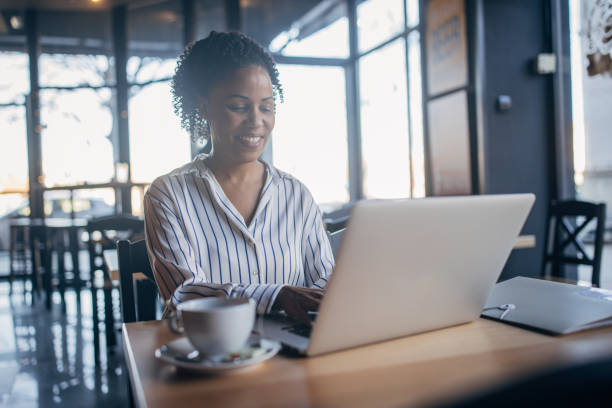 istock Businesswoman using laptop in cafe 2061279394