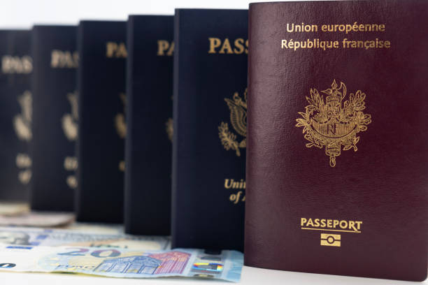 istock French and US Passports and Currency 2061285158