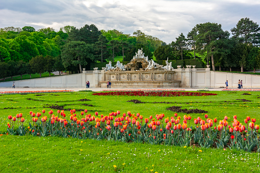 Vienna, Austria - April 2019: Neptune fountain in Schonbrunn park in spring