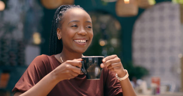 istock Cafe, thinking and black woman with a coffee, smile and choice with solution and relax on lunch break. African person, copywriter and entrepreneur with tea or cappuccino with ideas or problem solving 2061334401