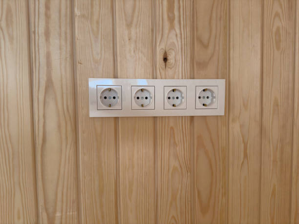 istock Electrical sockets on wooden wall. No people. 2061334422