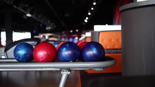 Close-up of bowling balls, skittles, bowling alley.