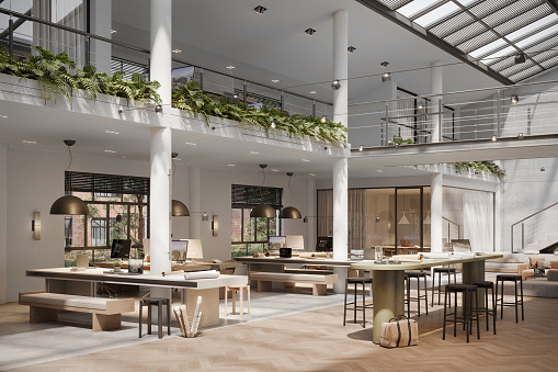 This digital representation captures a multilevel office interior with rich wooden textures and verdant plant life. The design emphasizes openness and a connection with nature, key features of a modern, sustainable workspace.