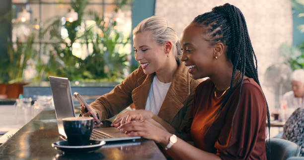 istock Coffee, smile and women with technology in cafe for collaboration freelance project. Conversation, laptop and team of creative designers working with phone and drinking cappuccino in restaurant. 2061355025
