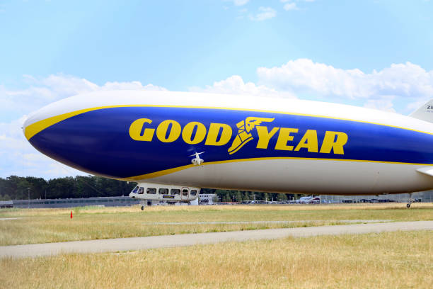 Meersburg, Germany- May 29, 2025: Goodyear Blimp advertisement airship zeppelin flying over Meersburg medieval city