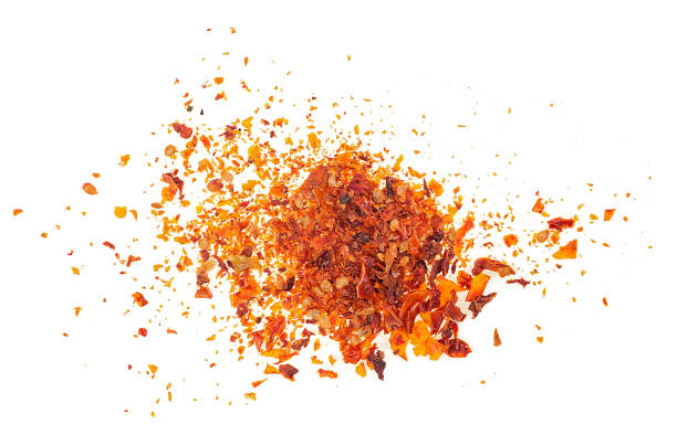 istock Dried and chopped tomatoes flakes isolated on a white background, top view. 2061380224