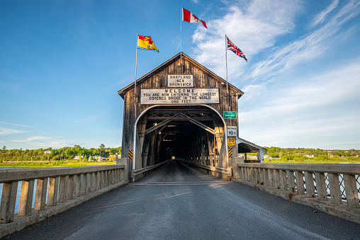 Hartland Covered Bridge front view in evening light with blue sky