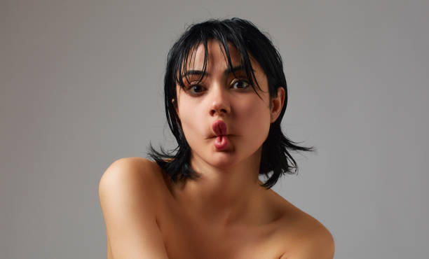 Portrait of beautiful woman with wet and short hair. Portrait of beautiful woman with wet and short hair. fish lips stock pictures, royalty-free photos & images
