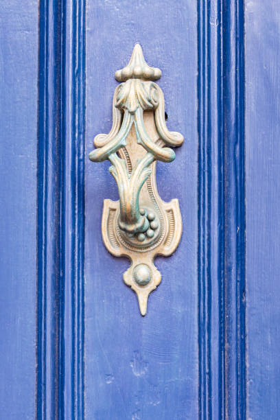 istock Brass knocker on a blue painted door. 2061426394