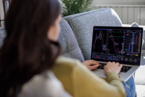 istock Young woman trading online 2061444783