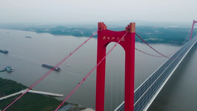 A cloudy cross river bridge