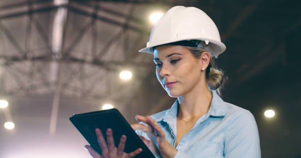 istock Construction, inspection and woman in warehouse with tablet for planning, development and manufacturing. Engineering, contractor or project manager in plant with online digital app for maintenance 2061480472