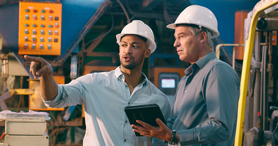 Manufacturing Conversation Planning Conversation And Men In Factory With Tablet For Engineering ...