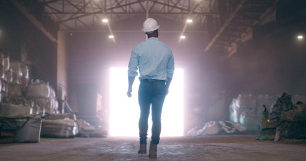 istock Warehouse, man or engineer with back for construction, stock and product for material in storage. People, contractor and property developer in discussion with ideas for building project in industry 2061481556