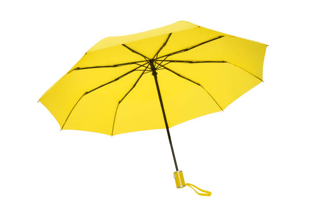 Open yellow umbrella isolated on white background stock photo