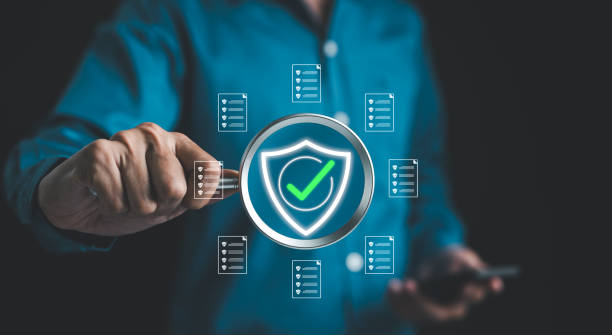 istock Businessman holding magnifying glass with standard quality control certification assurance guarantee for automation process. Quality management, Quality Assurance, Standardization, health insurance, 2061496415