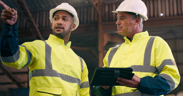 istock Quality control, tablet and men with planning, inspection and industry with warehouse and helmet for safety. Distribution, manufacturing and engineering with tech or online checklist with digital app 2061516159