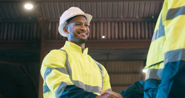 istock Handshake, people in construction and partnership for architecture project, maintenance and smile for introduction. Welcome, thank you and shaking hands with support and trust in contractor team 2061516160